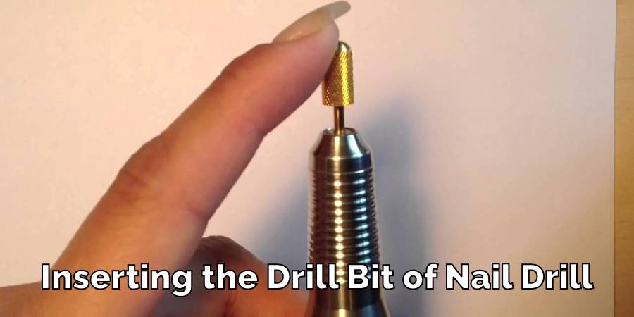 Inserting the Drill Bit of Nail Drill