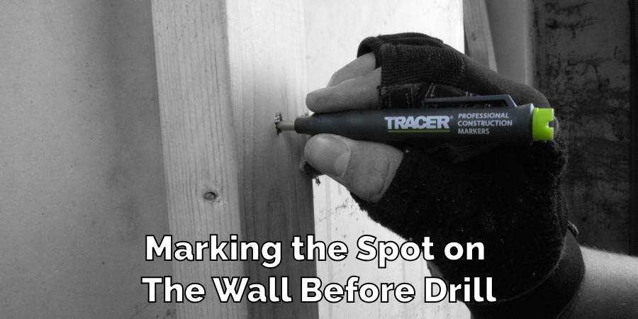 Marking the Spot on The Wall Before Drill