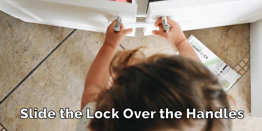 Slide the Lock Over the Handles